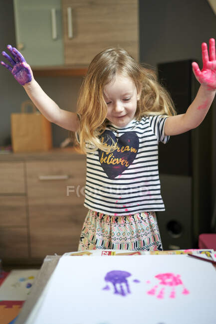 Cute little girl painting in kindergarden — Stock Photo