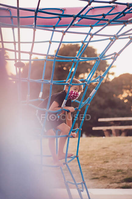 Cute boy playing on playground — Stock Photo