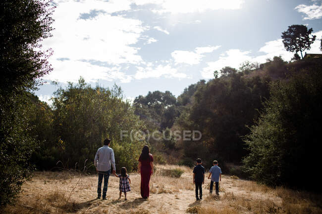 Family of Five Walking in Field in San Diego — Stock Photo