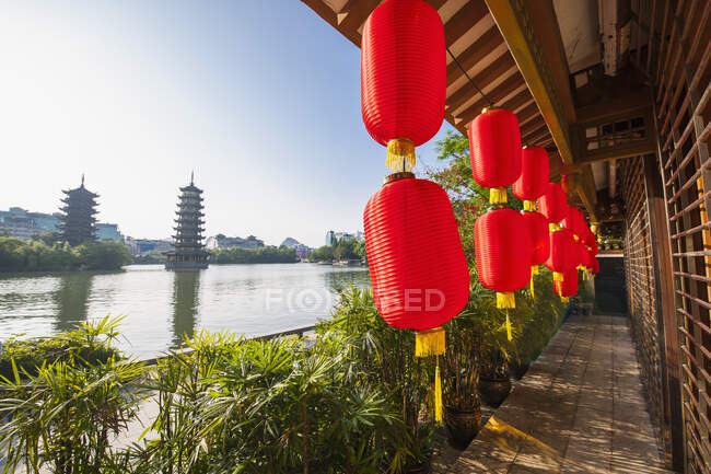 View of authentic chinese architecture and lanterns on foreground — Stock Photo
