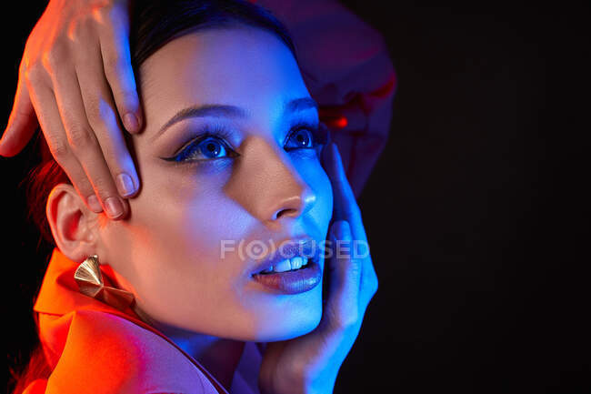 Close-up, face of young girl with bright makeup, neon photo filters — Stock Photo