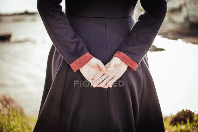 Woman from behind with palms open — Stock Photo