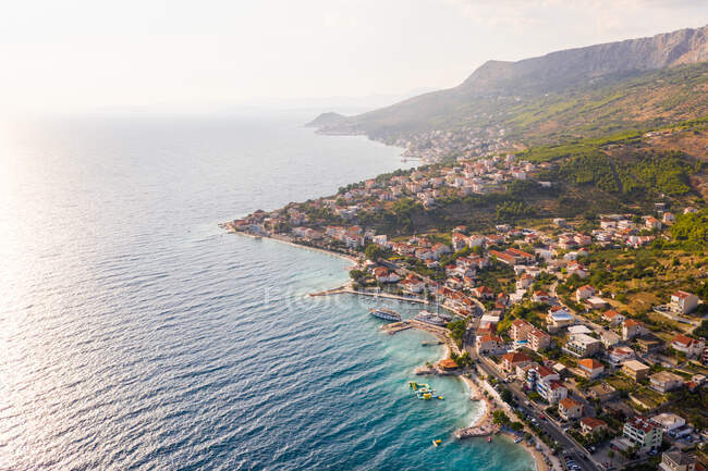 Aerial view of Dugi Rat costal city during a scenic sunset, Croatia. — Stock Photo