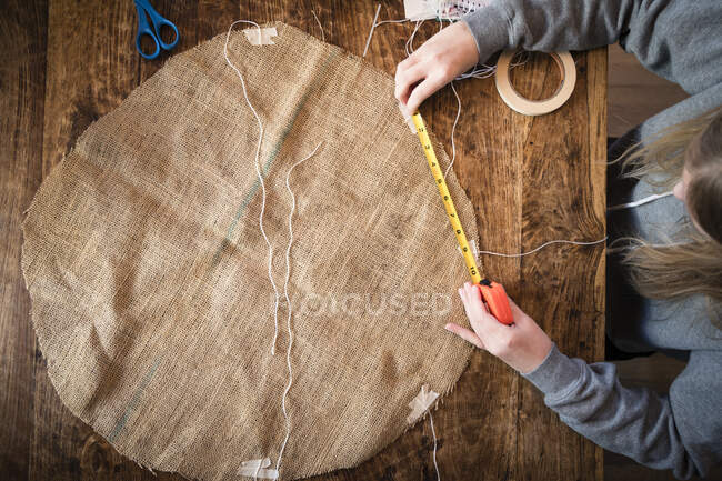 Overhead View of Student Working at Table on School Science Project — Stock Photo