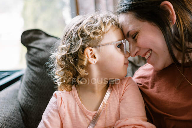 Mother and daughter with prescription glasses spending time together — Stock Photo