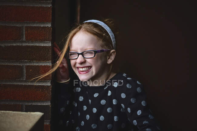 Adorable tween girl with red hair smiling. — Stock Photo