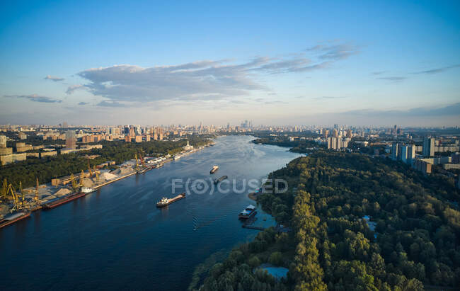 Aerial view of the river in city between park and port. Urban skyline — Stock Photo