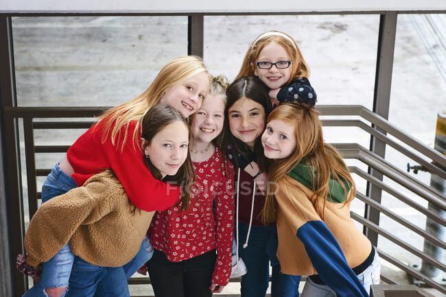 Group of 6 cute Tween girls hanging out having fun in the city. — Stock Photo