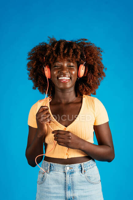 African woman having fun with the music — Stock Photo