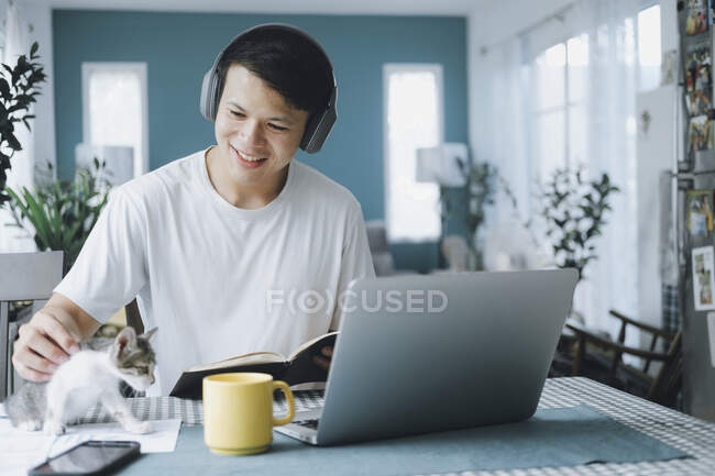 Asian businessman talking to colleague team in video call confer — Stock Photo