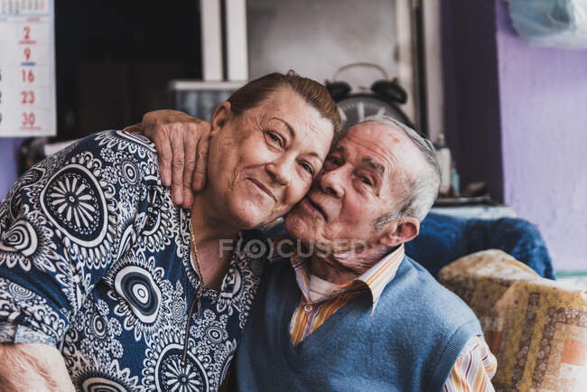 Portrait of an elderly couple embracing each other — Stock Photo