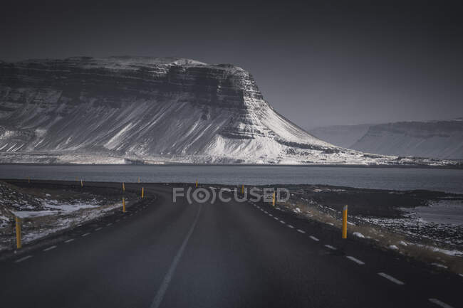 Road trip and mountains with snow on nature background — Stock Photo