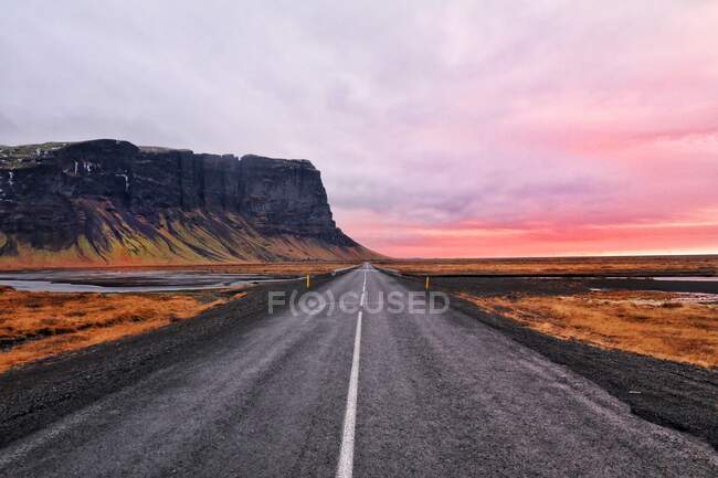 Road in the mountains at sunet on nature background — Stock Photo