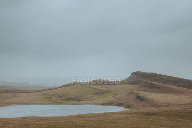 A vast landscape fills the scene while on the path of Hadrian's Wall in the United Kingdom. — Stock Photo