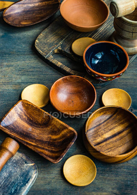 Variety of rustic bowls on wooden table — Stock Photo