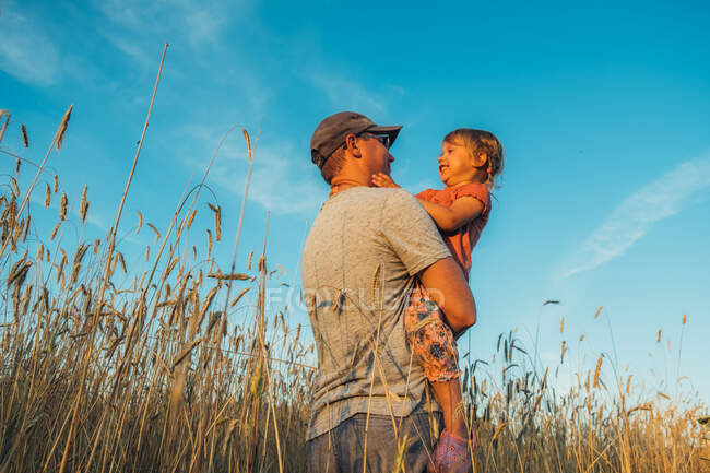 Father playing with his cute little daughter. Great family vacation. — Stock Photo
