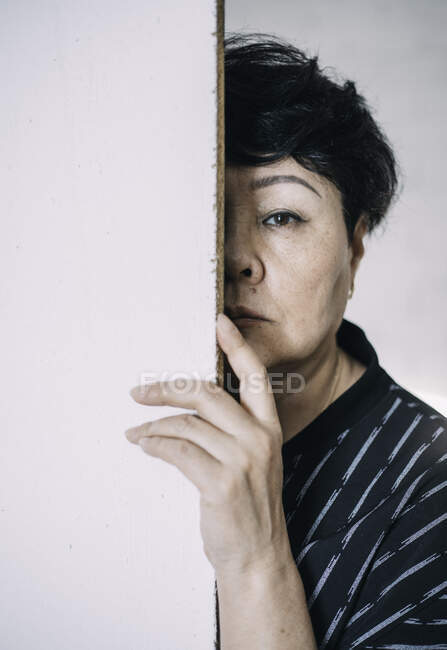 Portrait of an attractive elegant senior asian woman in a studio — Stock Photo
