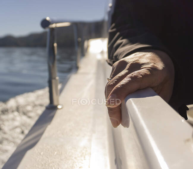 Female hand on parapet — Stock Photo