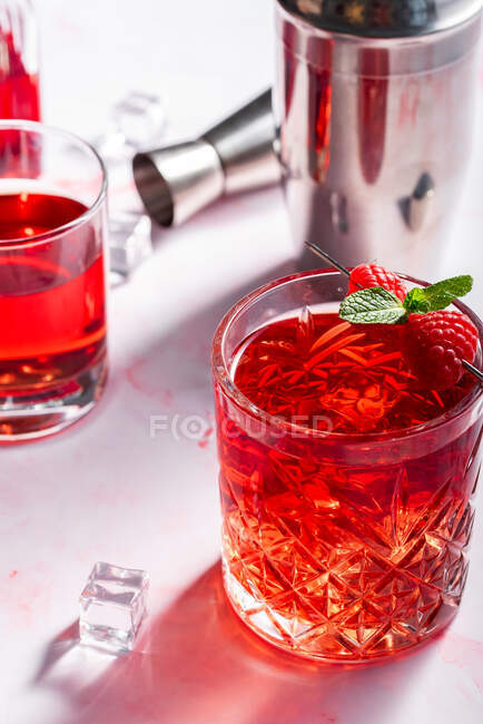 Raspberry cocktail with mint on a white background — Stock Photo