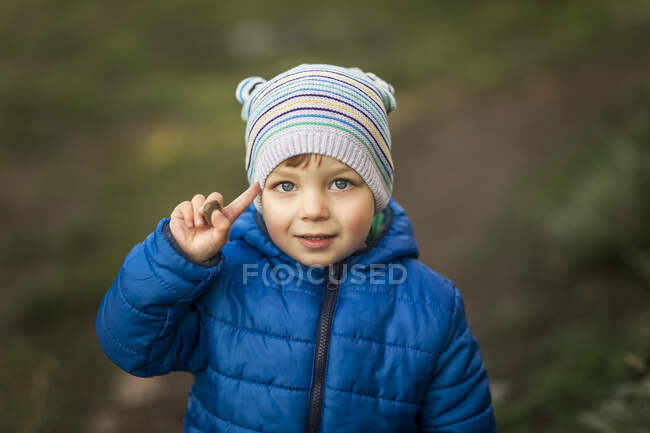 Portrait of blonde little boy with blue eyes and blue jacket sal — Stock Photo