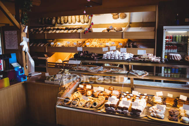 Various sweet foods in bakery shop — Stock Photo