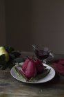 Still life of Spiced red wine poached pears — Stock Photo