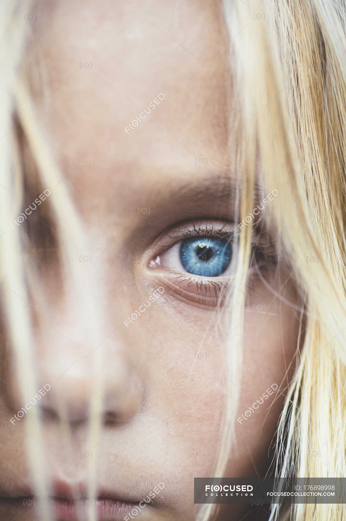 Blonde close up Close Up Shot Of Beautiful Blonde Preteen Girl Partial View Of Blue Eye Female Candid Stock Photo 176898998