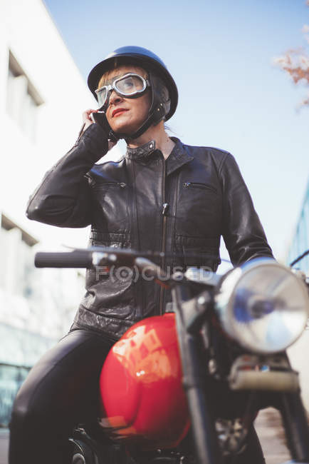 Stylish and trendy sports woman talking on the phone close-up — Stock Photo