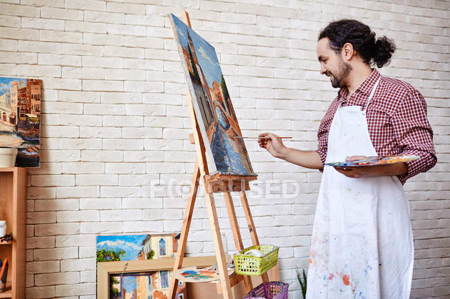 Professional artist painting picture — Stock Photo