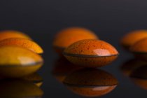 Chocolate candies with orange glaze — Stock Photo