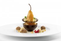 Baked pear dessert with chocolate on plate — Stock Photo