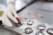 Close-up view of confectioner making chocolate decorations — Stock Photo