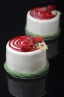Cakes with white marzipan glaze and fresh strawberries — Stock Photo