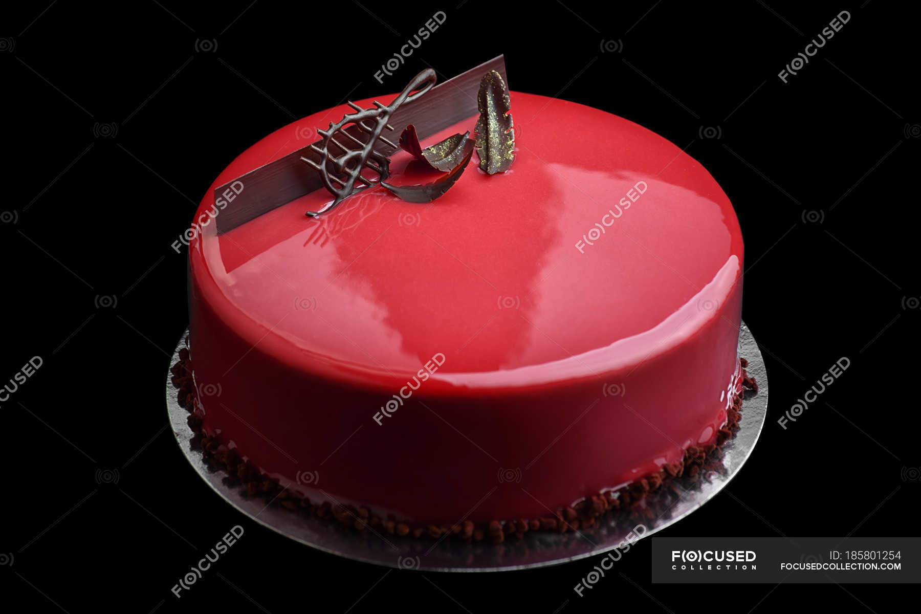 Cake with red glaze and chocolate music key decoration — gourmet ...