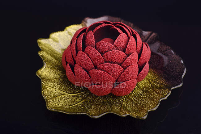 Flower  dessert  isolated on dark background — Stock Photo
