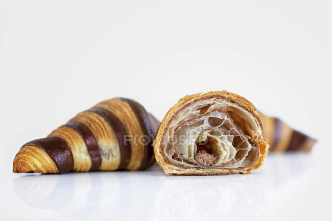 Croissants with striped pattern on white background — Stock Photo