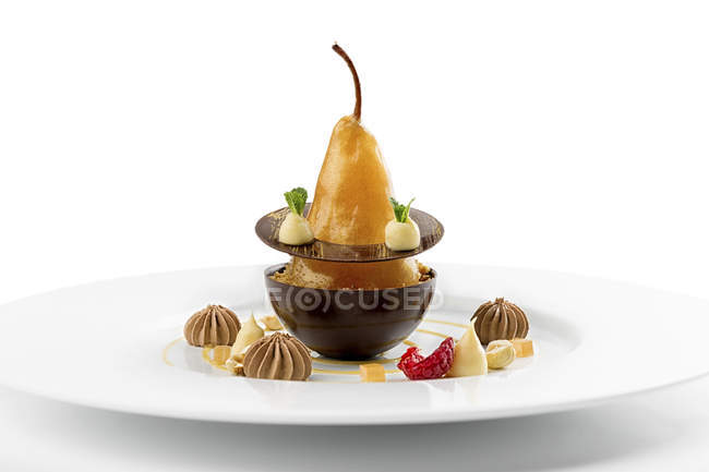 Baked pear dessert with chocolate on plate — Stock Photo