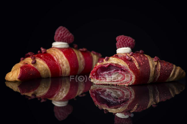 Croissants with striped pattern and berry filling — Stock Photo