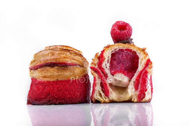 Rolled buns with raspberry jam filling — Stock Photo