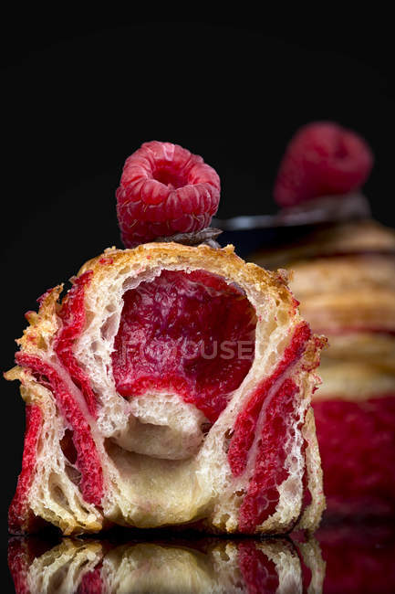 Rolled buns with raspberry jam filling — Stock Photo