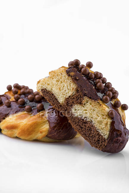 Chocolate buns decorated with balls — Stock Photo