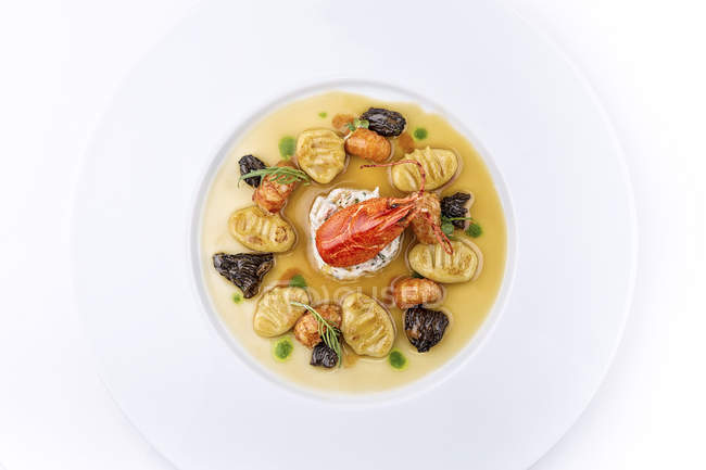 Lobster dish with gnocchi and morels mushrooms — Stock Photo