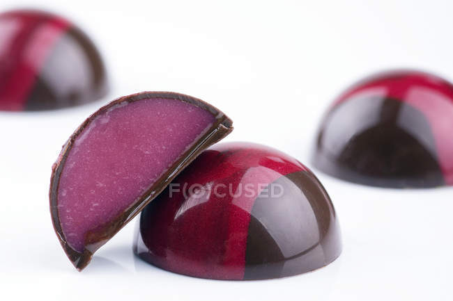Chocolate candies with pink filling — Stock Photo