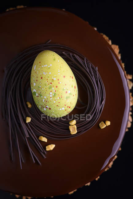Top view of egg decoration on chocolate cake — Stock Photo