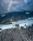 Aerial view of mountain range with houses under winter cloudy sky Black Forest, Baden-Wurttemberg, Germany — Stock Photo