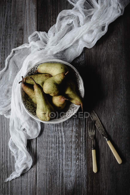 Top view with pears with vintage cutlery on rustic table — Stock Photo