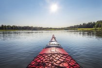 View of lake with sun lighted landscape from Kayak — Stock Photo