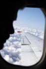 Profile of man sitting in airplane, differential focus — Stock Photo