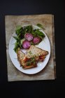 Top view of sandwich served with beets and spinach on plate — Stock Photo