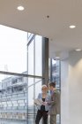Business people discussing project in corridor, selective focus — Stock Photo